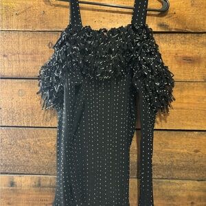 Pretty black blouse with whiter threading design.